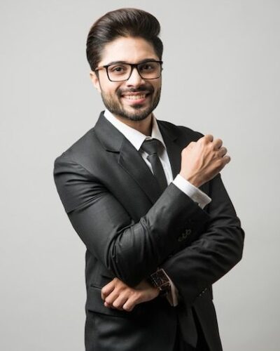 Portrait of indian male businessman standing over white background _ Premium Photo