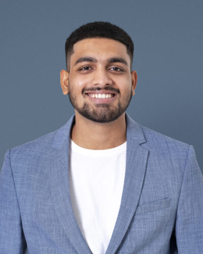 Cheerful Indian businessman smiling closeup portrait for jobs an