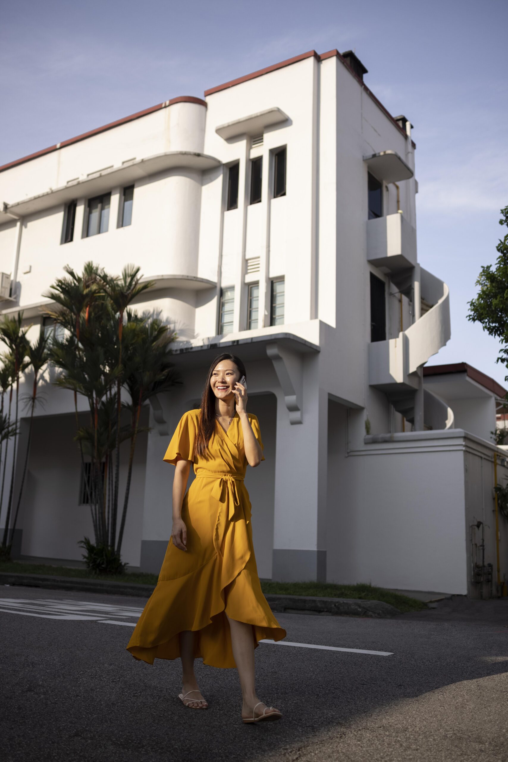 portrait-beautiful-asian-woman-posing-city-while-wearing-yellow-dress